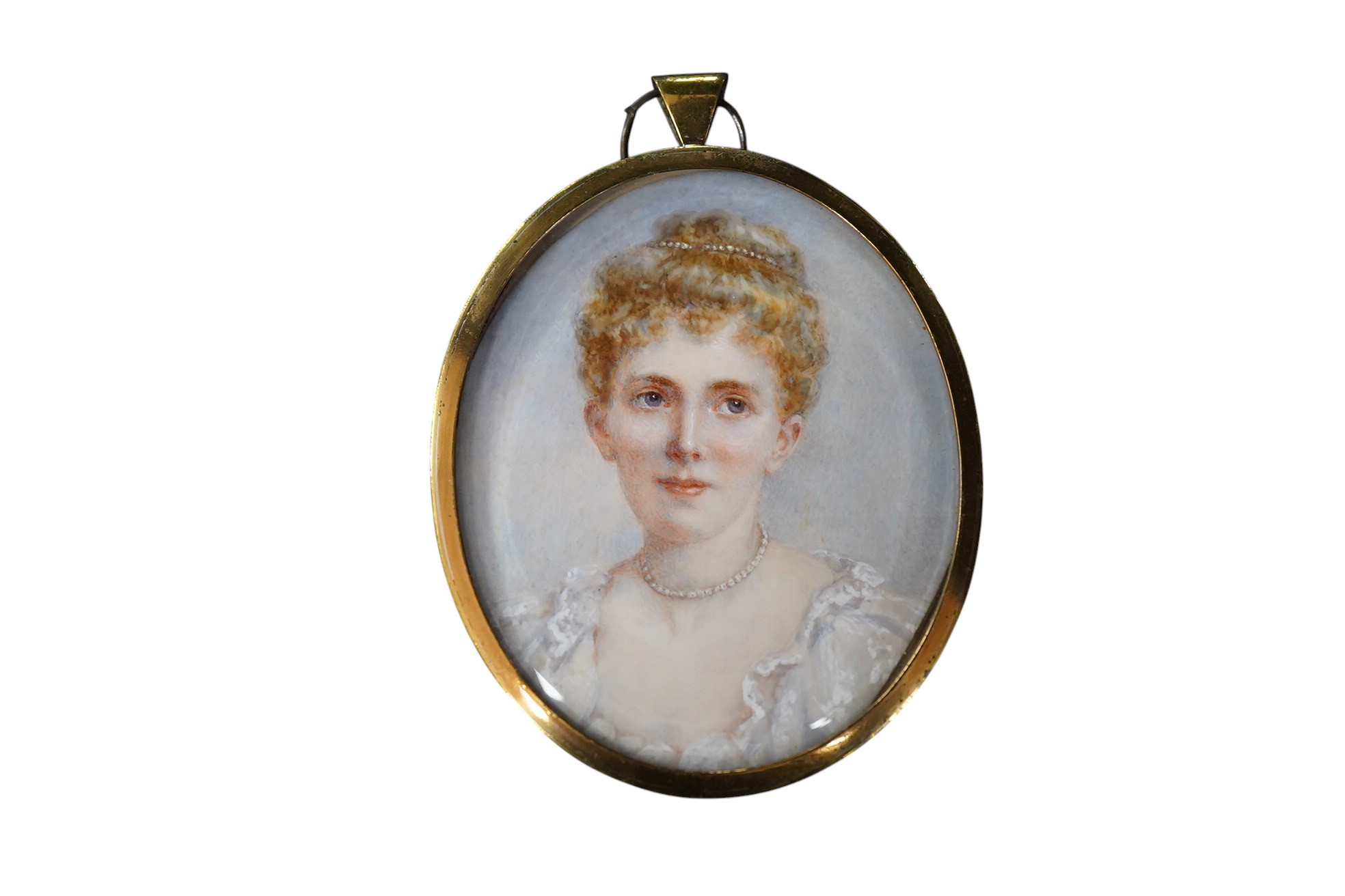 Edwardian School, Portrait miniature of a young lady wearing a beaded necklace, oval watercolour on ivory, 6 x 5cm, housed in a gilt metal pendant frame CITES Submission reference, 1RZX399Q